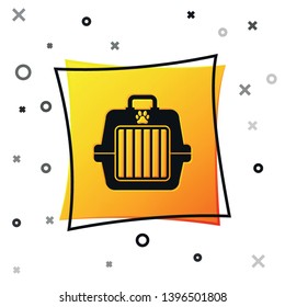 Black Pet carry case icon isolated on white background. Carrier for animals, dog and cat. Container for animals. Animal transport box. Yellow square button. Vector Illustration