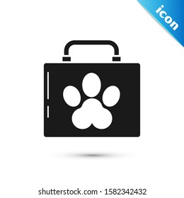 Black Pet first aid kit icon isolated on white background. Dog or cat paw print. Clinic box.  Vector Illustration