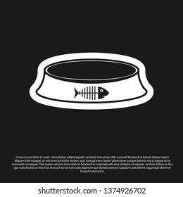 Black Pet food bowl for cat or dog icon isolated on black background. Fish skeleton sign. Vector Illustration