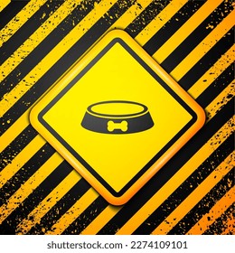 Black Pet food bowl for cat or dog icon isolated on yellow background. Dog bone sign. Warning sign. Vector