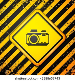 Black Photo camera icon isolated on yellow background. Foto camera. Digital photography. Warning sign. Vector