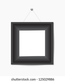 Black photo frame hanging on white wall