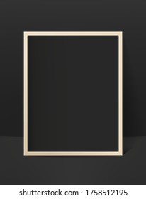 Black photo frame in black interior. Template for design