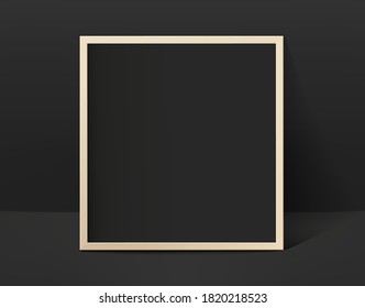 Black photo frame in black interior. Template for design