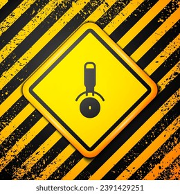 Black Pizza knife icon isolated on yellow background. Pizza cutter sign. Steel kitchenware equipment. Warning sign. Vector