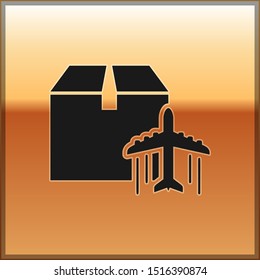 Black Plane and cardboard box icon isolated on gold background. Delivery, transportation. Cargo delivery by air. Airplane with parcels, boxes.  Vector Illustration