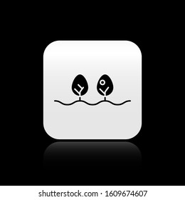 Black Plant icon isolated on black background. Silver square button. Vector Illustration