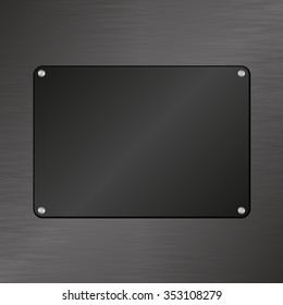 black plaque on textured background