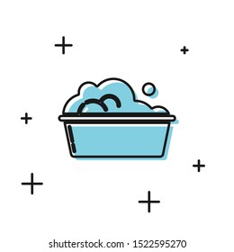 Black Plastic basin with soap suds icon isolated on white background. Bowl with water. Washing clothes, cleaning equipment.  Vector Illustration