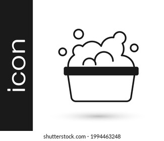 Black Plastic basin with soap suds icon isolated on white background. Bowl with water. Washing clothes, cleaning equipment.  Vector