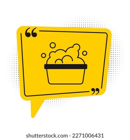 Black Plastic basin with soap suds icon isolated on white background. Bowl with water. Washing clothes, cleaning equipment. Yellow speech bubble symbol. Vector