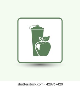 black plastic vitamin shaker and apple,
