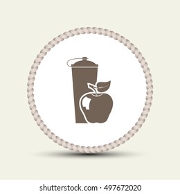 black plastic vitamin shaker and apple,