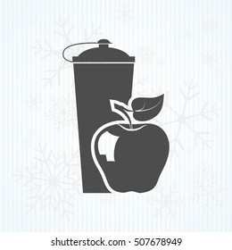 black plastic vitamin shaker and apple,
