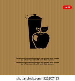 black plastic vitamin shaker and apple,