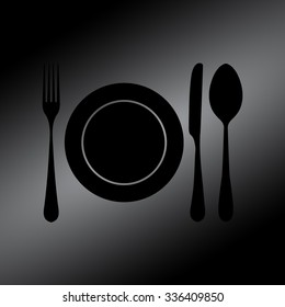 Black plate with spoon, knife and fork 