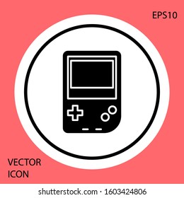 Black Portable video game console icon isolated on red background. Gamepad sign. Gaming concept. White circle button. Vector Illustration