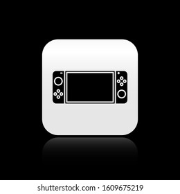 Black Portable video game console icon isolated on black background. Gamepad sign. Gaming concept. Silver square button. Vector Illustration