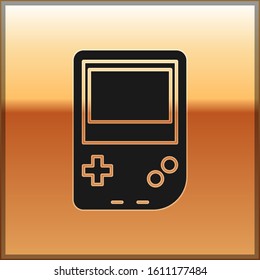 Black Portable video game console icon isolated on gold background. Gamepad sign. Gaming concept.  Vector Illustration