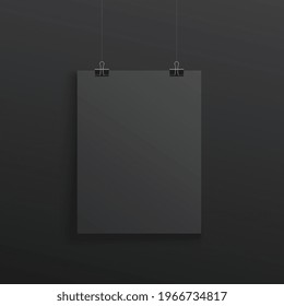 Black poster hanging with binder clips - realistic mockup on dark background. Blank A4 paper sheet with blank copy space - design display template, vector illustration