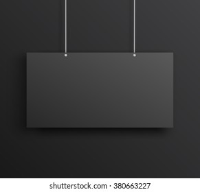 Black poster mockup on the black wall