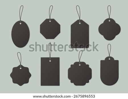 Black price tag collection with string attachments for discount labels or retail displays. Kraft paper shapes designs with cord loops. Blank vintage tags for sales advertise or product marking.