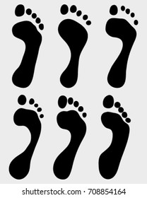 Black prints of bare feet