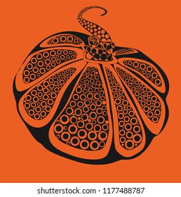 Black pumpkin on an orange background