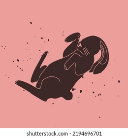 Black rabbit on a pink background with splashes of black. The hare is flying or jumping. Symbol of 2023. Vector trendy illustration for design, t-shirt prints, stickers.