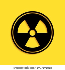 Black Radioactive icon isolated on yellow background. Radioactive toxic symbol. Radiation Hazard sign. Long shadow style. Vector.