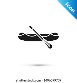 Black Rafting boat icon isolated on white background. Inflatable boat with paddles. Water sports, extreme sports, holiday, vacation.  Vector Illustration