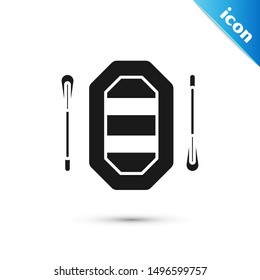 Black Rafting boat icon isolated on white background. Inflatable boat with paddles. Water sports, extreme sports, holiday, vacation.  Vector Illustration