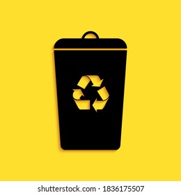 Black Recycle bin with recycle symbol icon isolated on yellow background. Trash can icon. Garbage bin sign. Recycle basket sign. Long shadow style. Vector.