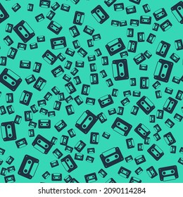 Black Retro audio cassette tape icon isolated seamless pattern on green background.  Vector