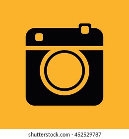 Black retro camera vector illustration. Yellow background