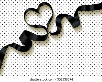 Black ribbon on a polka dots background.