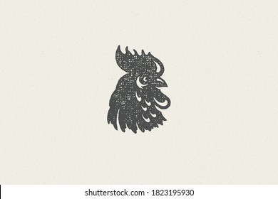 Black rooster head silhouette for poultry farm industry hand drawn stamp effect vector illustration. Vintage grunge texture emblem for butchery packaging and menu design or label decoration