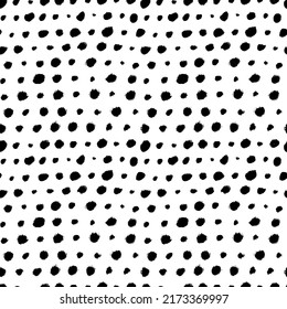 Black round specks in a row seamless pattern. Vector different spots, polka dot ornament. Abstract monochrome background with hand painted small ink blobs. Polka dot motif wallpaper.