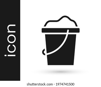 Black Sand in bucket icon isolated on white background. Plastic kid toy. Summer icon.  Vector