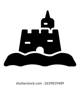 A black sand castle icon features a central tower, side walls, a front entrance and rests on sand, representing a vacation or a day at the beach.