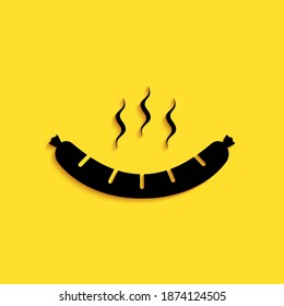Black Sausage with steam icon isolated on yellow background. Grilled sausage and aroma sign. Long shadow style. Vector.