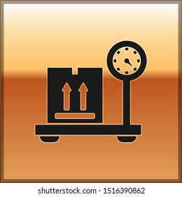 Black Scale with cardboard box icon isolated on gold background. Logistic and delivery. Weight of delivery package on a scale.  Vector Illustration