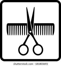 black scissors and comb on white background in frame