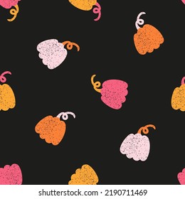 Black seamless pattern with orange and pink pumpkins for Halloween decoration
