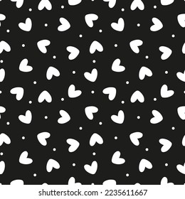 Patrón negro sin fisuras con corazones y puntos blancos