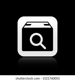 Black Search package icon isolated on black background. Parcel tracking symbol. Magnifying glass and cardboard box. Logistic and delivery. Silver square button. Vector Illustration