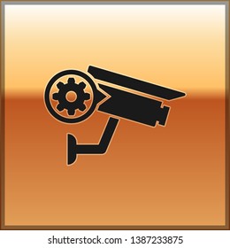 Black Security camera and gear icon isolated on gold background. Adjusting app, service concept, setting options, maintenance, repair, fixing. Vector Illustration