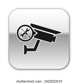 Black Security camera with screwdriver and wrench icon isolated on white background. Adjusting, service, setting, maintenance, repair, fixing. Silver square button. Vector Illustration