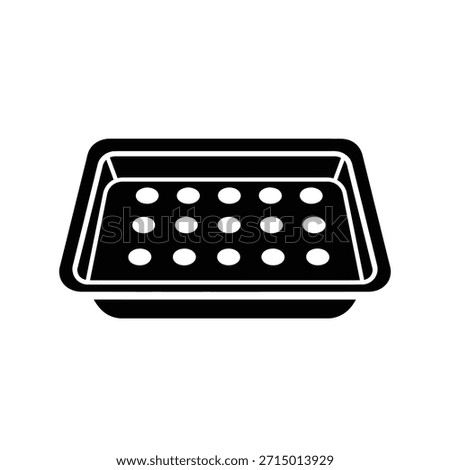Black seedling tray with multiple circular indentations for planting.