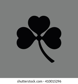 Black shamrock icon vector illustration. Gray background